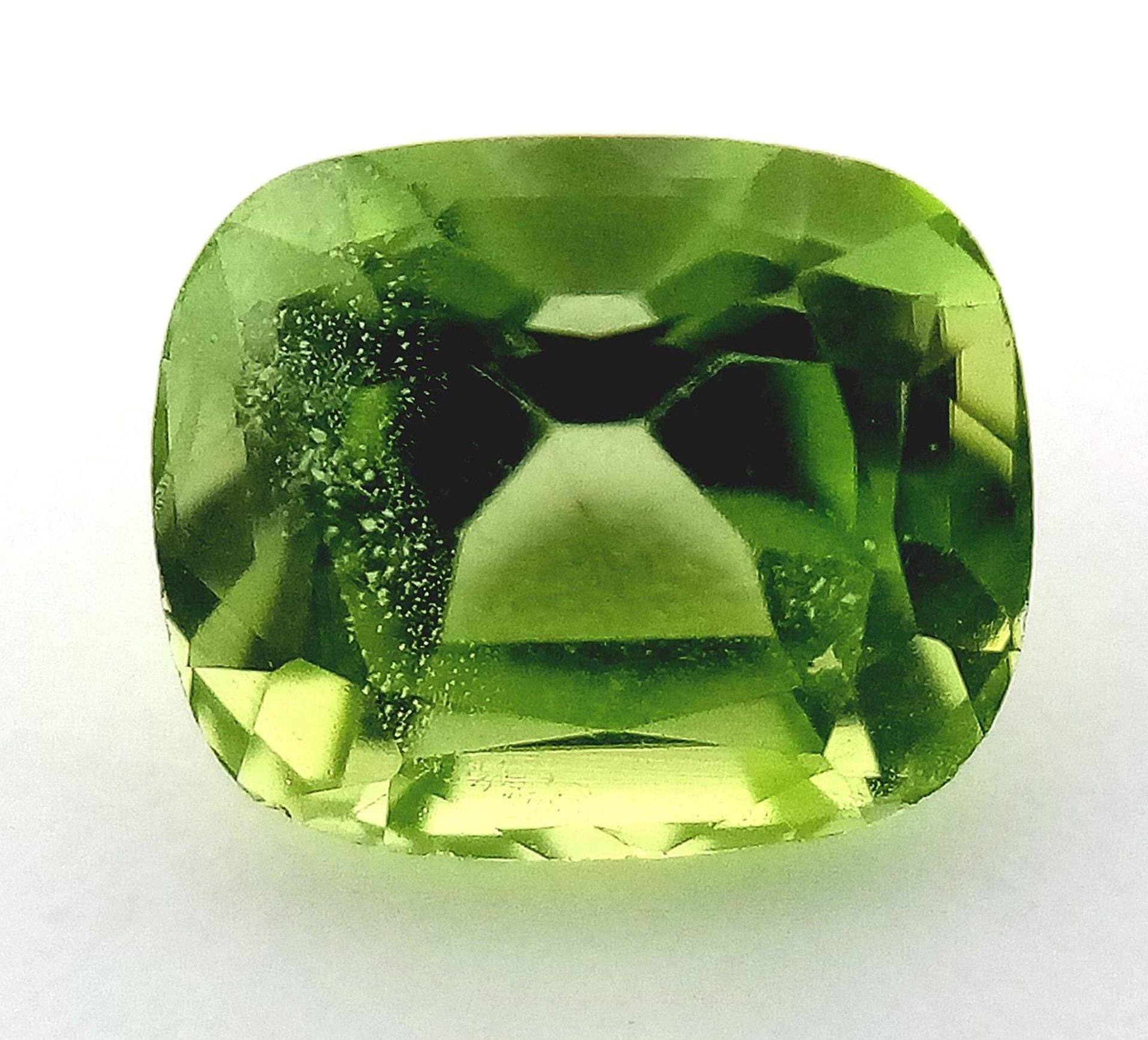 A 1.96ct Pakistan Natural Peridot, in the Cushion shape cut. Comes with the GFCO Swiss