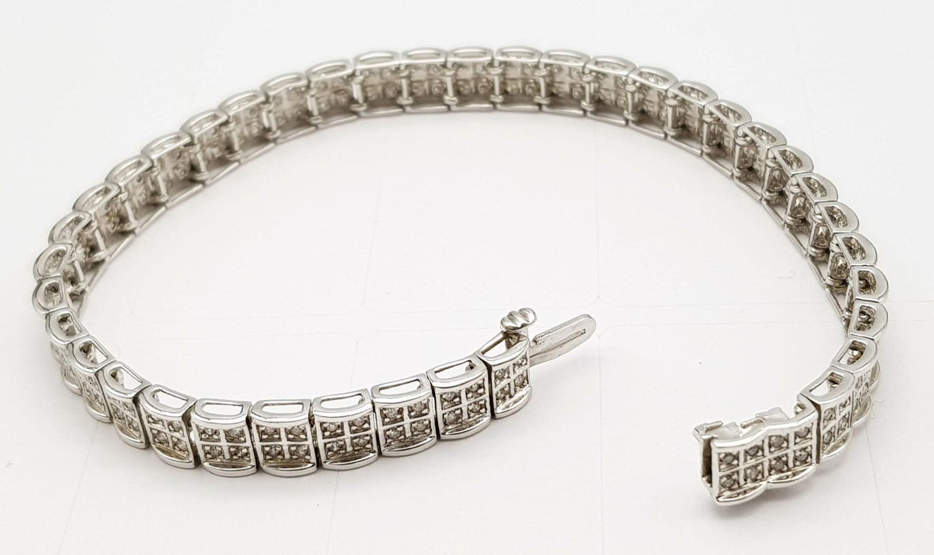 A 9K White Gold Diamond Set Bracelet, with Under Safety Catch Fitting. 1ctw, 19cm length, 12.7g - Image 3 of 14