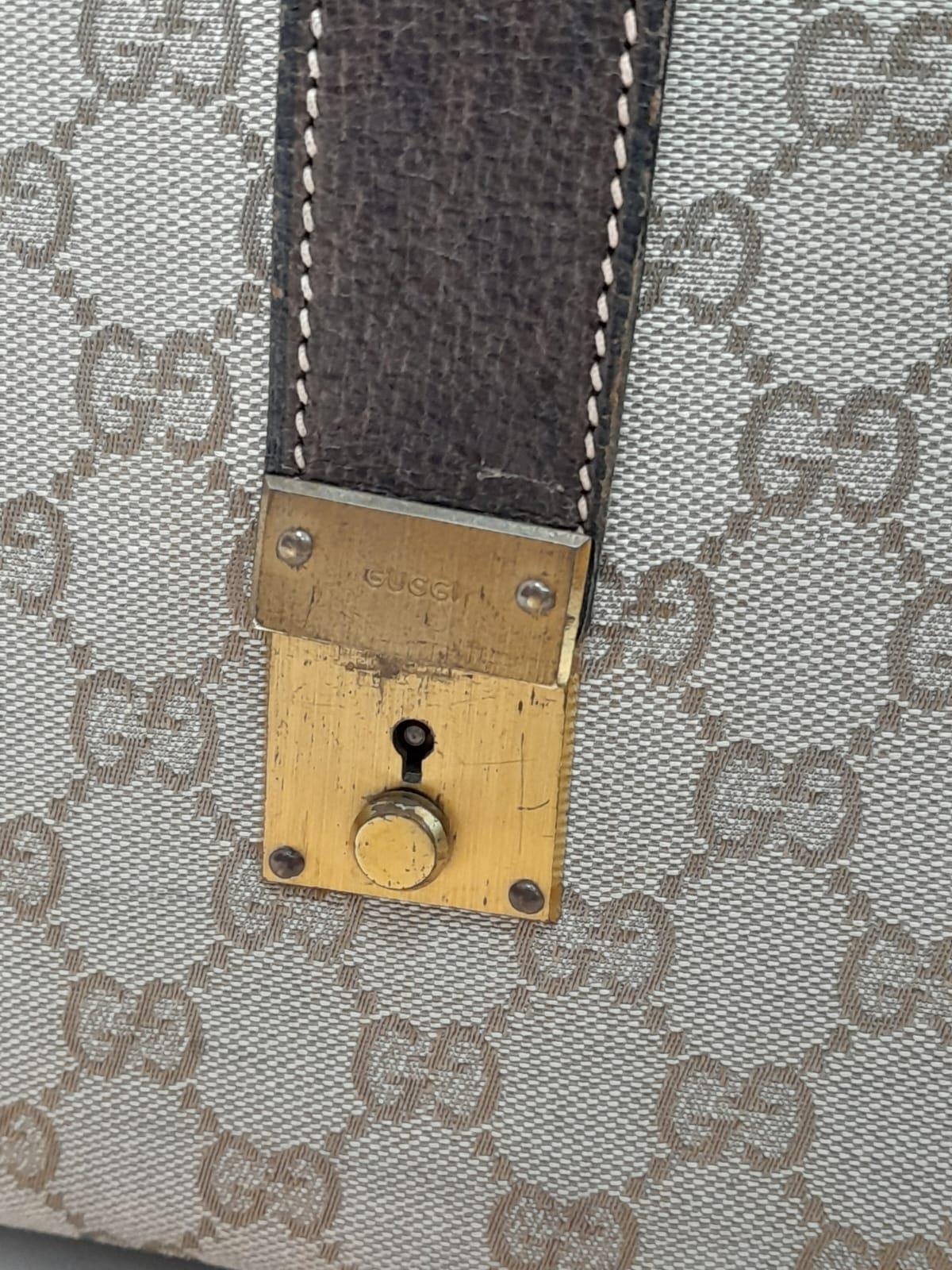 A Gucci Monogram Hard Train Vanity Case. Textile exterior with leather trim, two rolled leather - Image 6 of 7