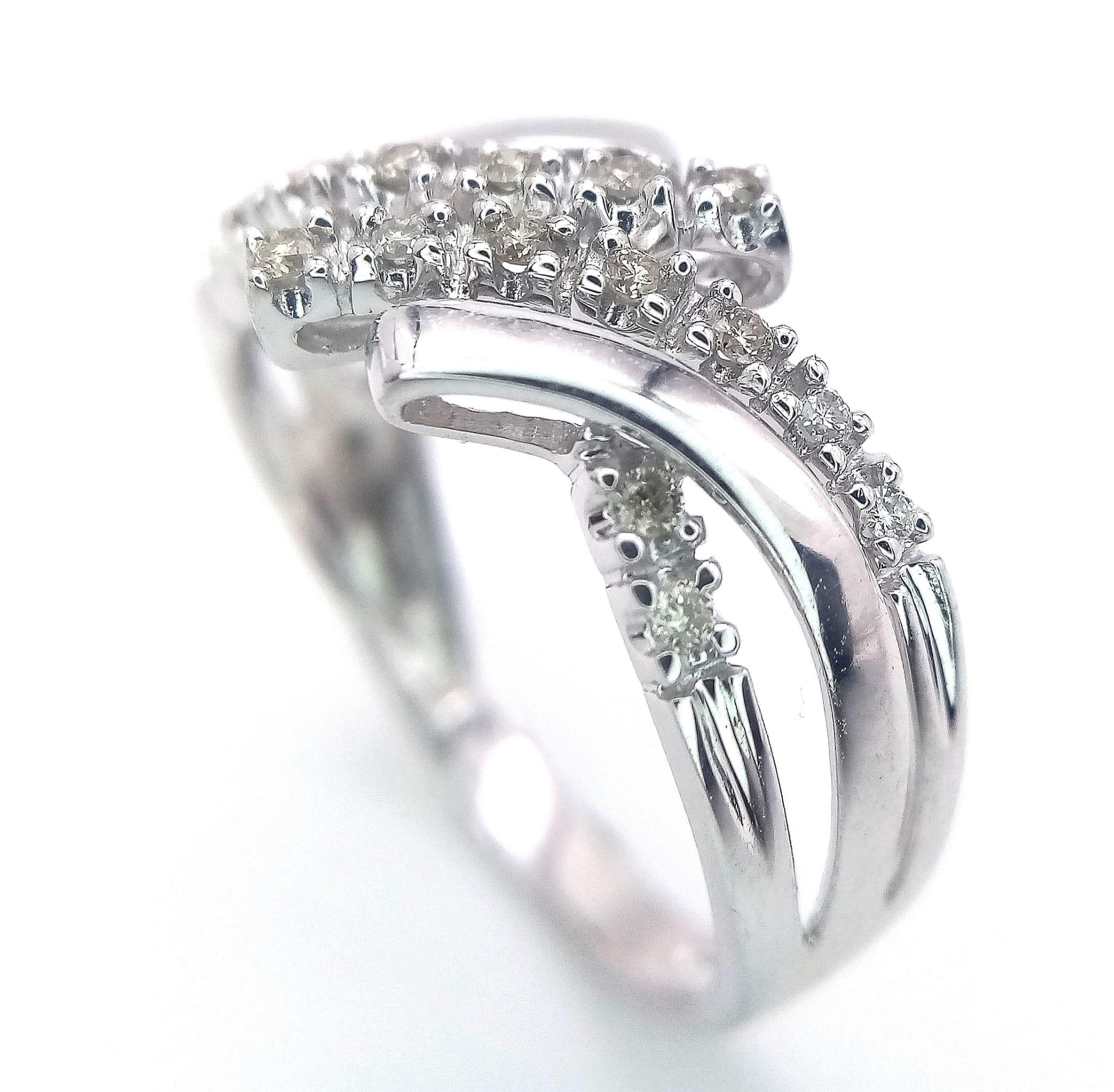 A FANCY 9K WHITE GOLD DIAMOND CROSSOVER RING, APPROX 0.15CT DIAMONDS, WEIGHT 2.6G SIZE Q - Image 4 of 12