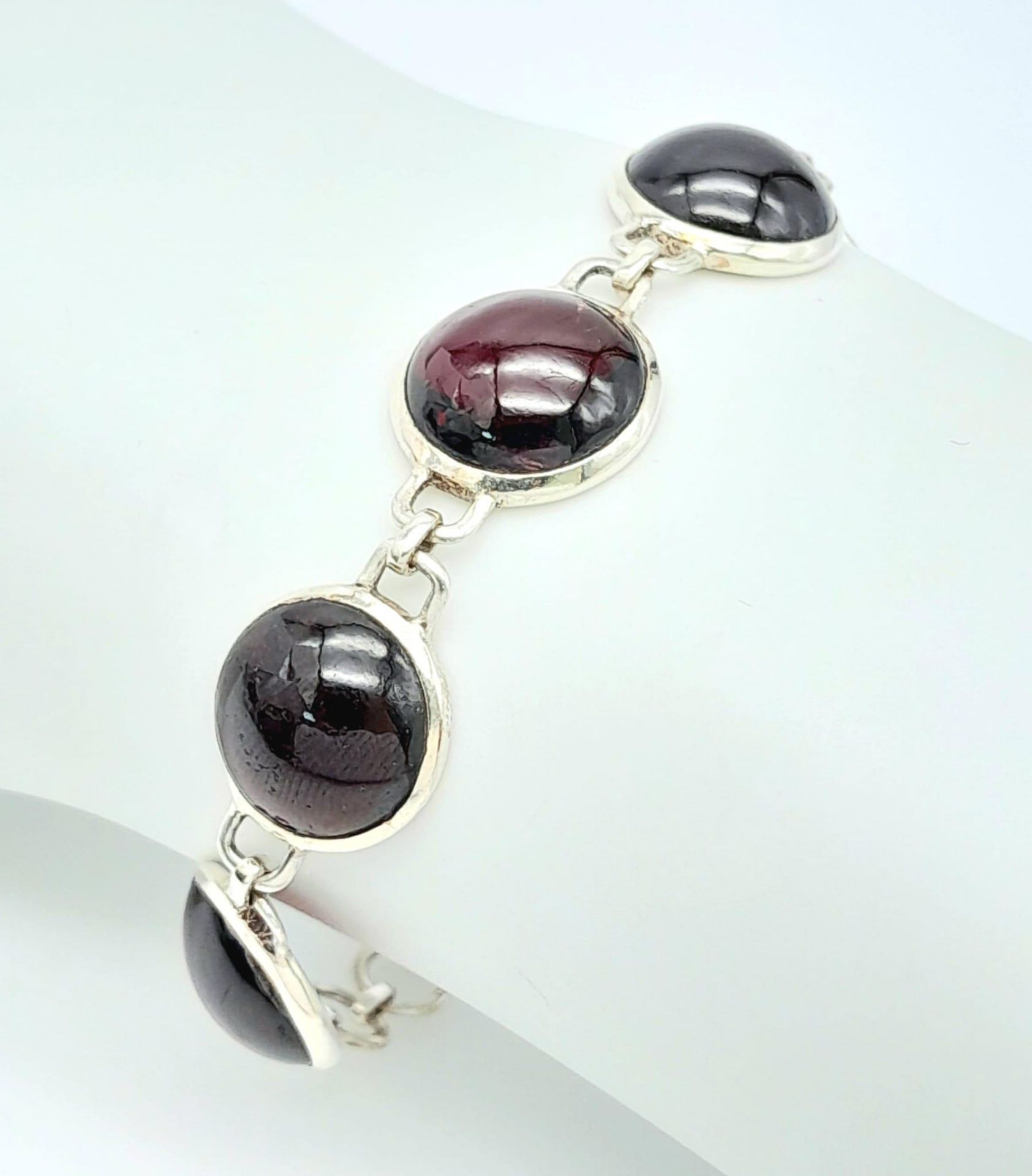 A Sterling Silver Red Stone Cabochon Set Bracelet. 19cm Length. 1.3cm Width. Gross Weight 12.75 - Image 4 of 10