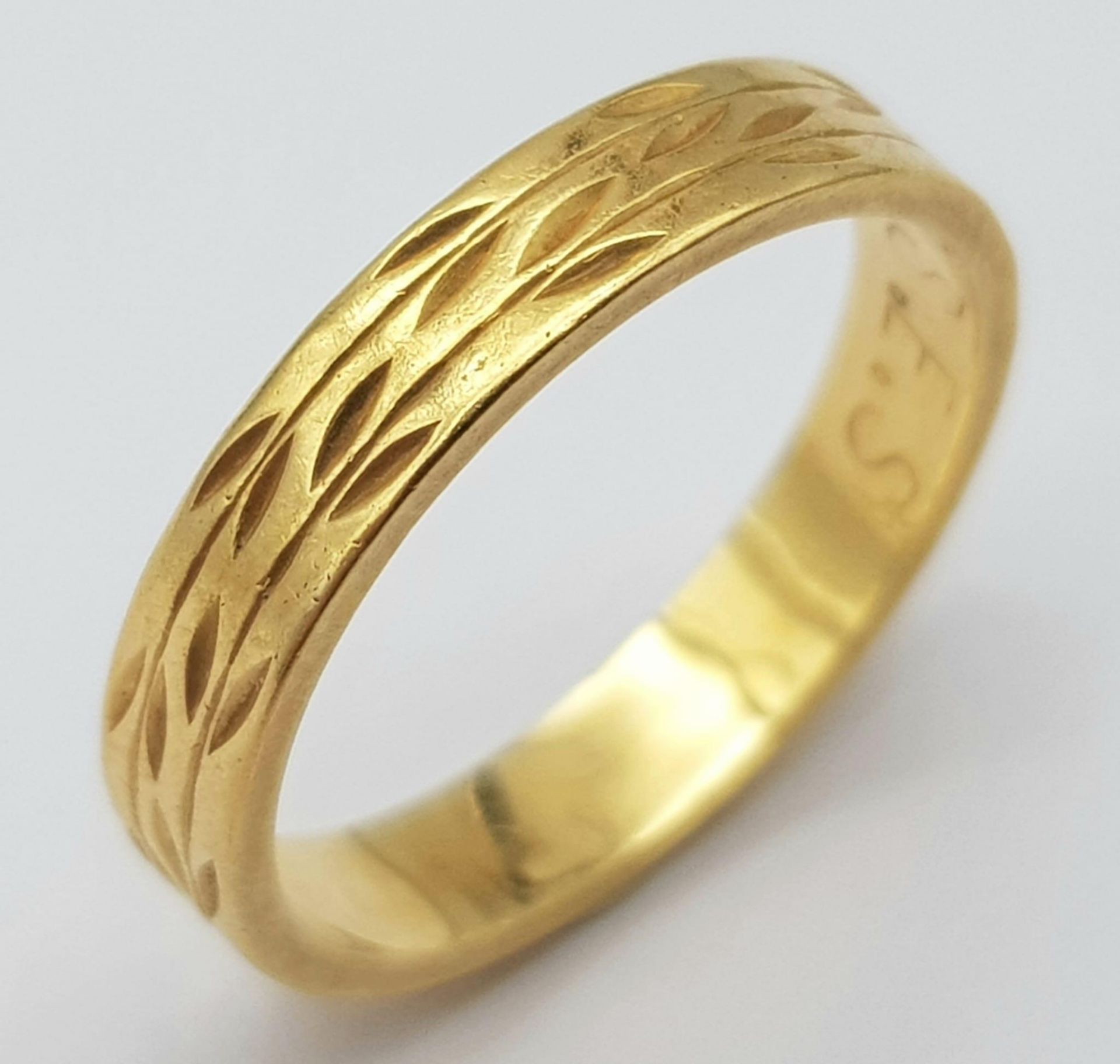An 18K Yellow Gold Band Ring. 3mm width. Size H. 2.4g weight.