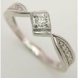 A 9K White Gold Diamond Ring. 0.20ctw, Size R, 2.3g total weight. Ref: 8445