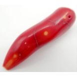 A 69.20ct Natural Italian Bamboo Red Coral, in the Oval Cabochon shape. Comes with the GLI