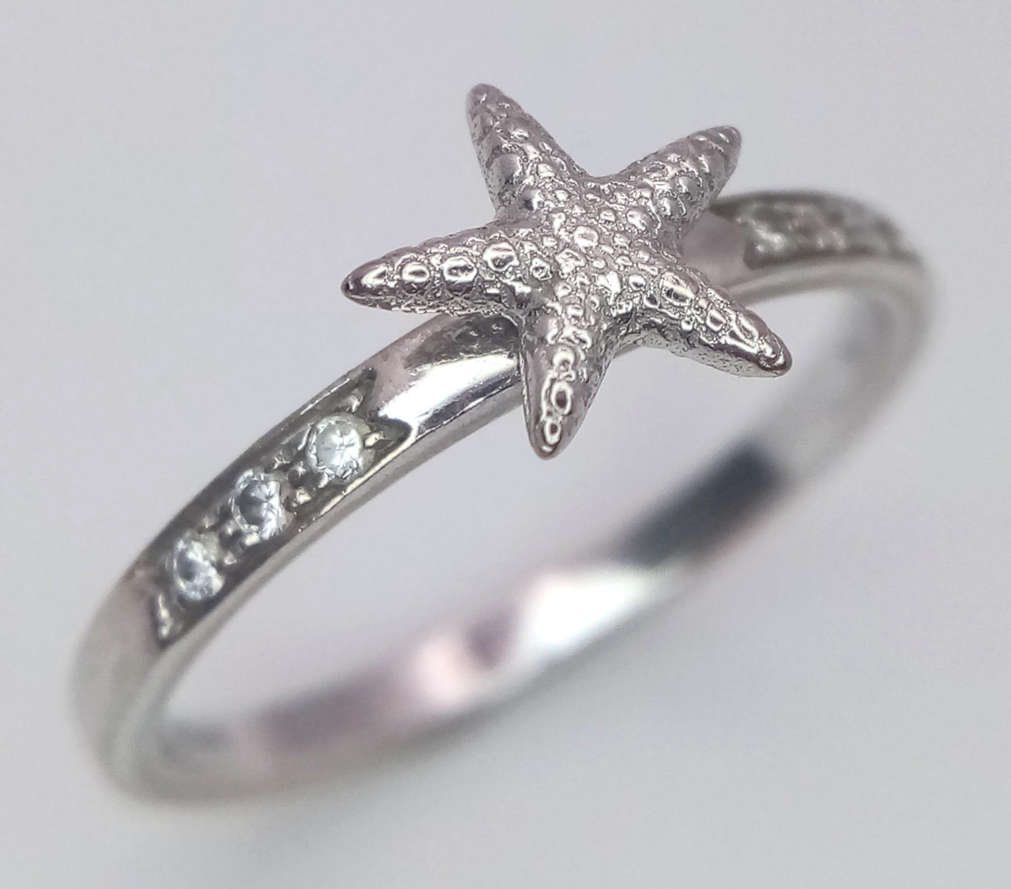 An 18K White Gold Theo Fennell Starfish Diamond Set Ring. Size N, 4.8g total weight. Ref: SC 7064