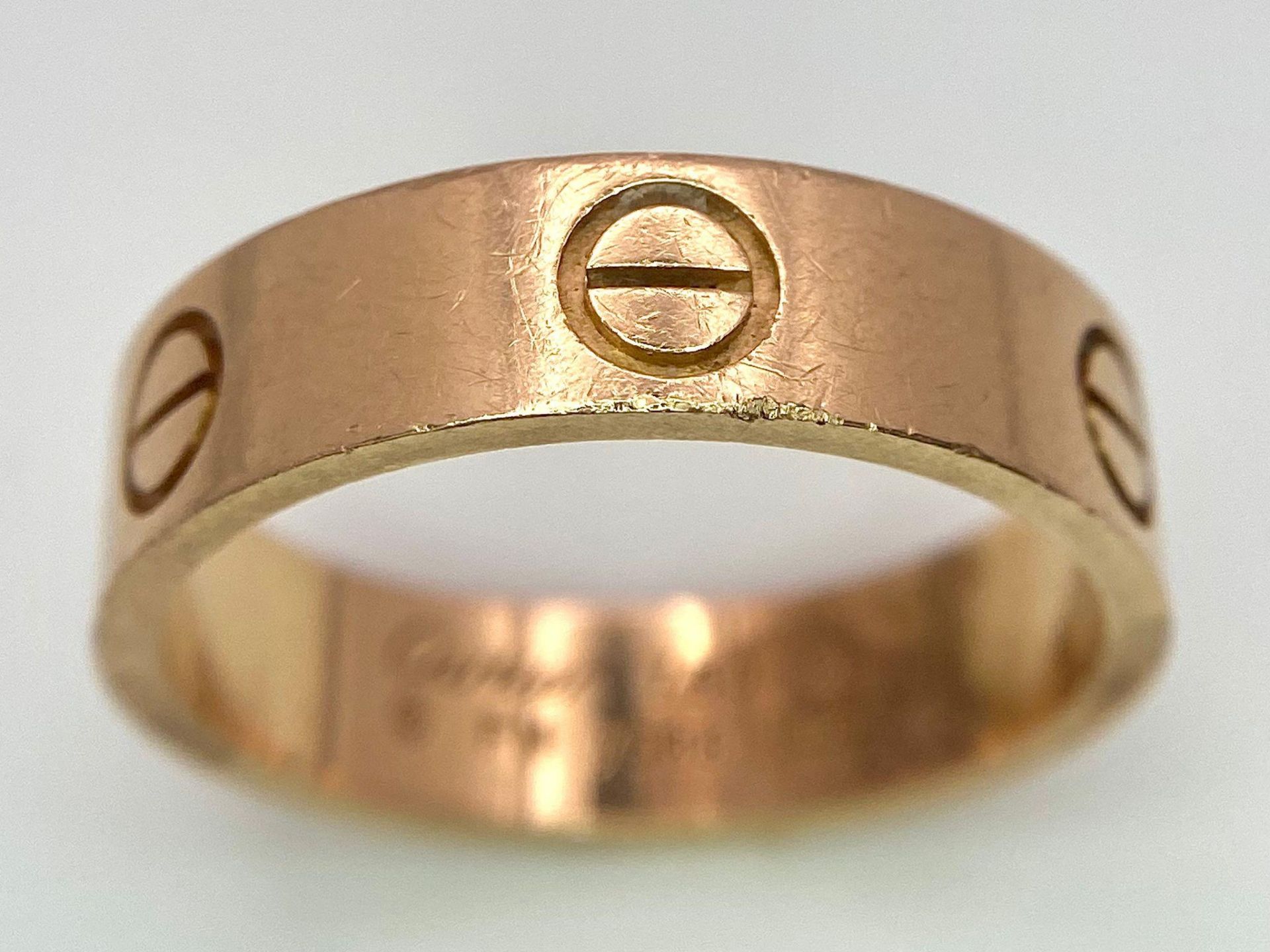 A Cartier 18K Rose Gold Love Band Gents Ring. 6mm width. Cartier hallmarks. Size W. 8.6g weight. - Image 2 of 9