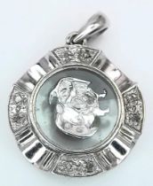 A VERY CUTE 18K WHITE GOLD DIAMOND SET PENDANT WITH SPINNING DOG IN THE CENTRE! 2.2G. 2CM.