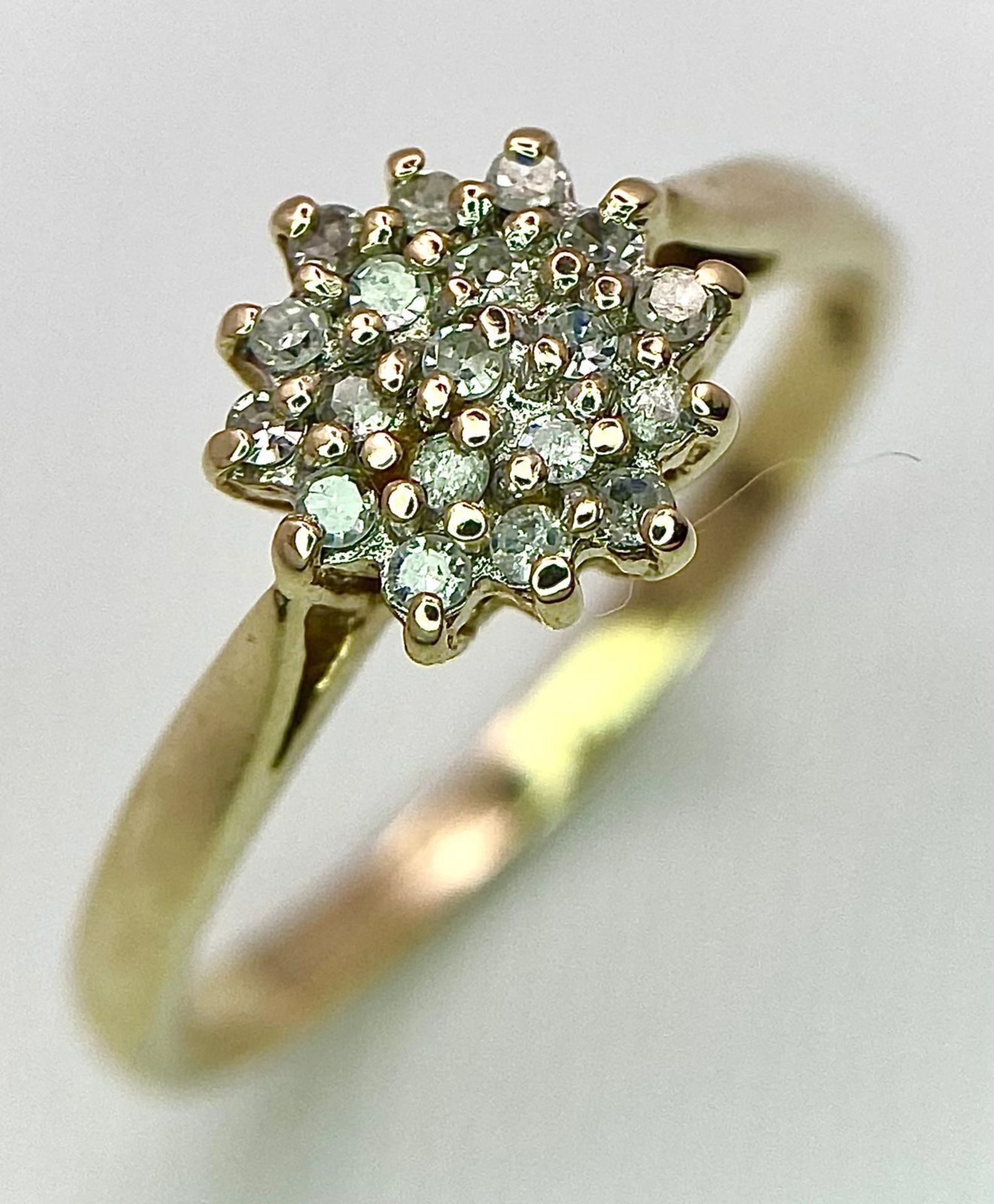 A 9K YELLOW GOLD DIAMOND CLUSTER RING. 0.15CT. 2.2G. SIZE P. - Image 4 of 13