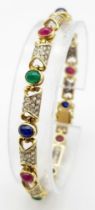 A GORGEOUS 18K YELLOW GOLD DIAMOND, SAPPHIRE, RUBY & EMERALD SET BRACELET. 1.50CTW OF ENCRUSTED