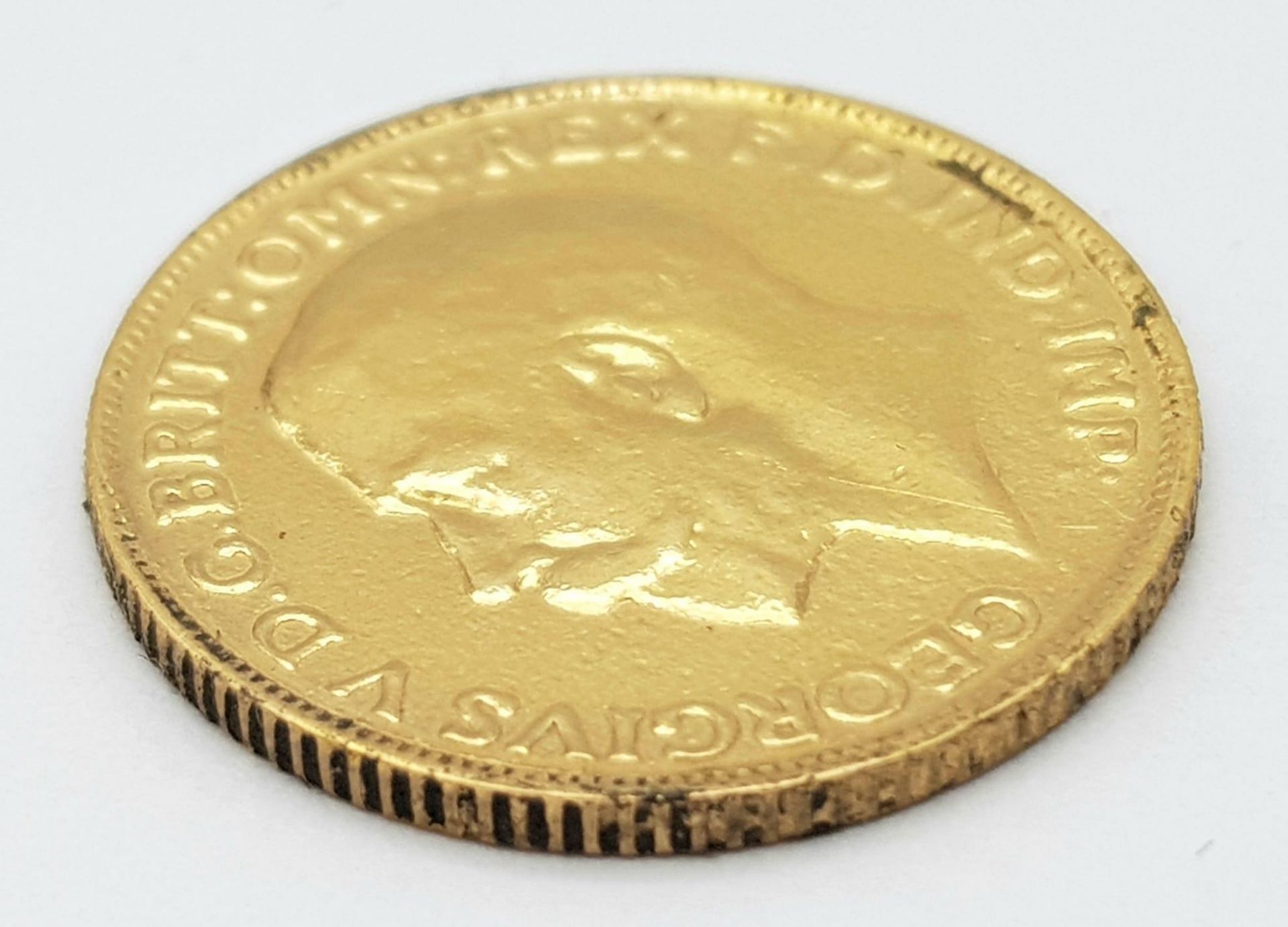 A 22K GOLD SOVEREIGN DATED 1913 . - Image 2 of 4