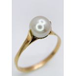 A VINTAGE 18K GOLD AND PEARL RING . 1.8gms size N