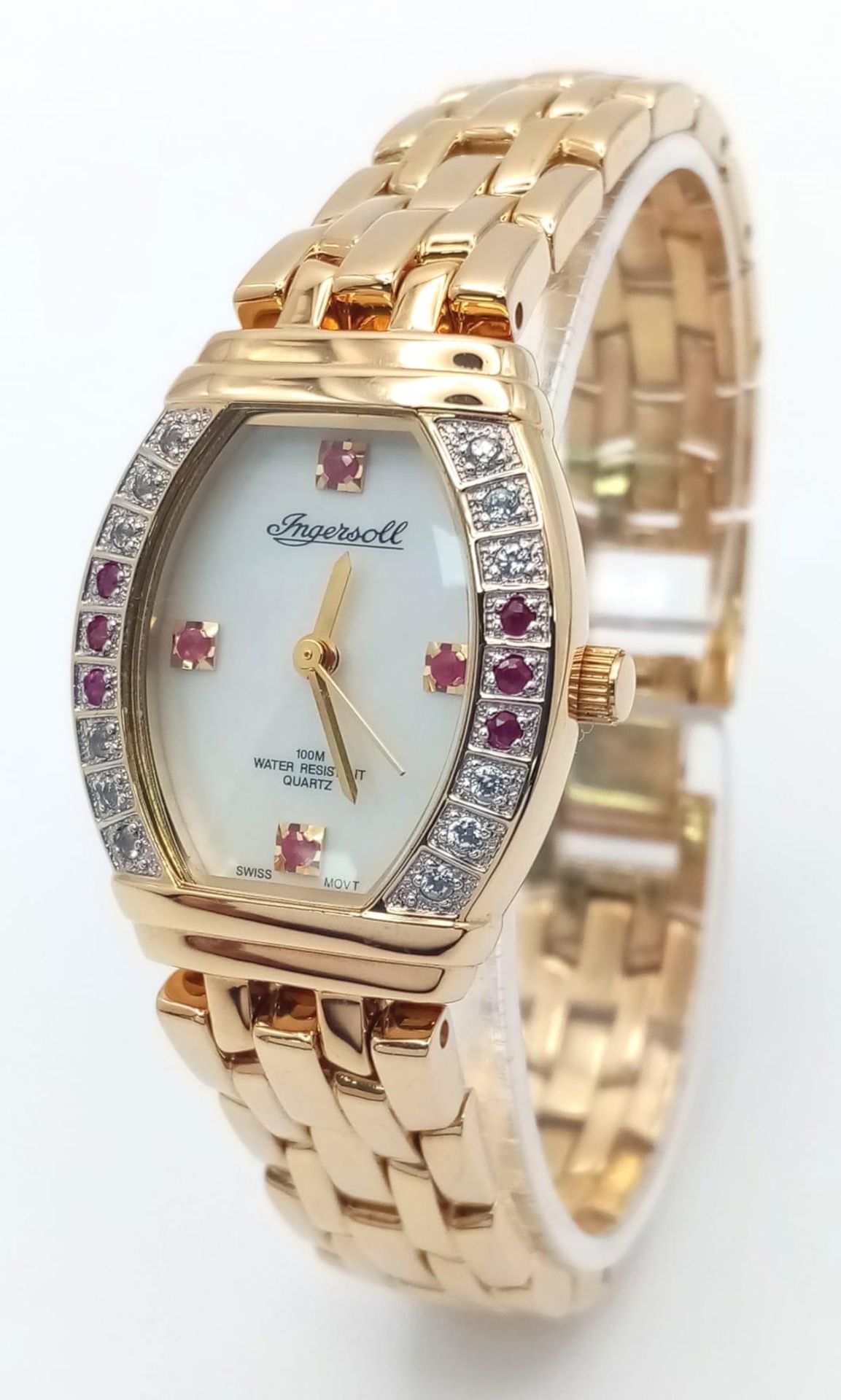 An Ingersoll Stone Set Quartz Ladies Watch. Gold plated bracelet and case - 25mm. White dial with