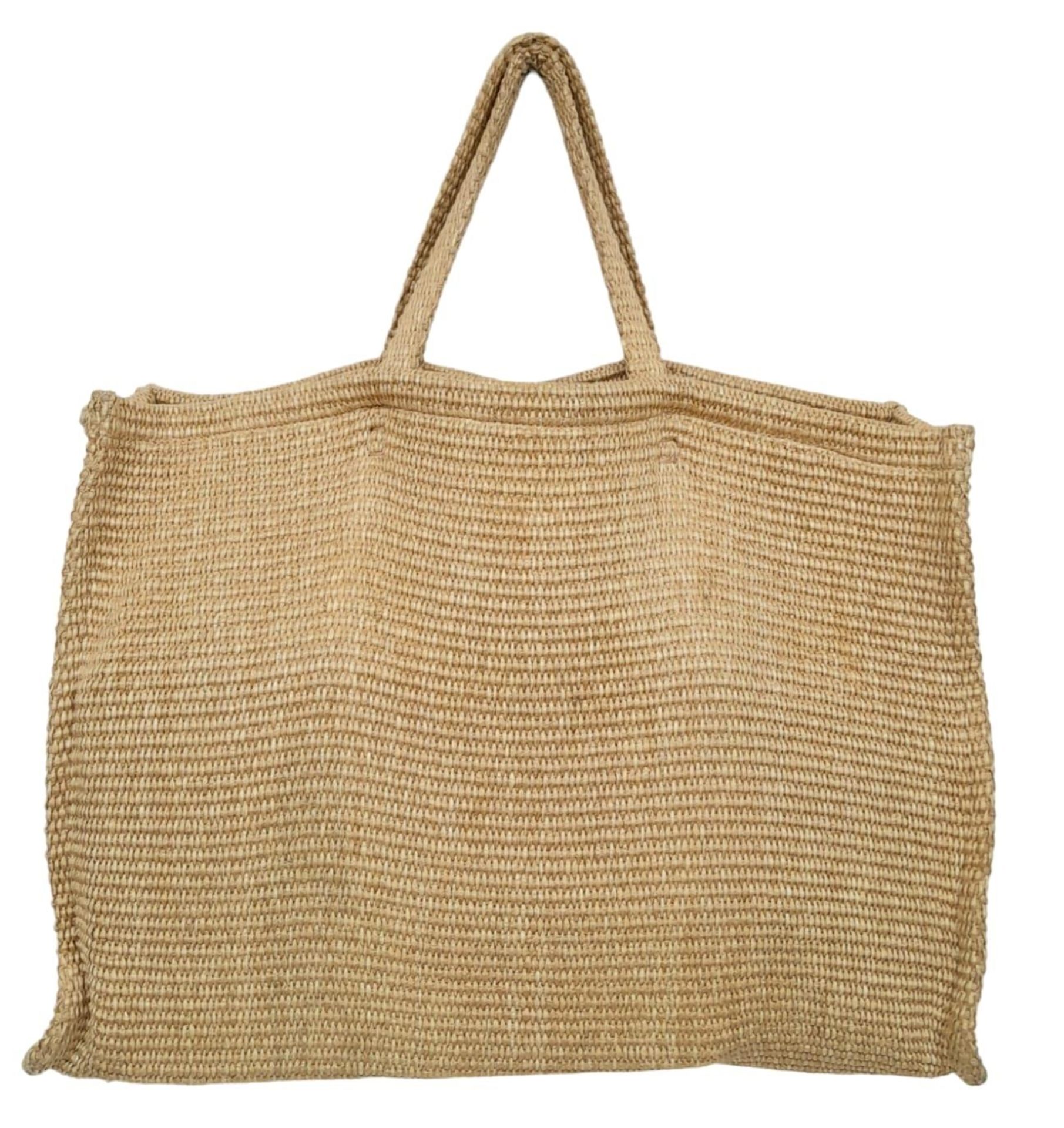 A Givenchy Raffia Tote Bag. Woven textile exterior with two straps. Woven textile interior with an - Image 3 of 5