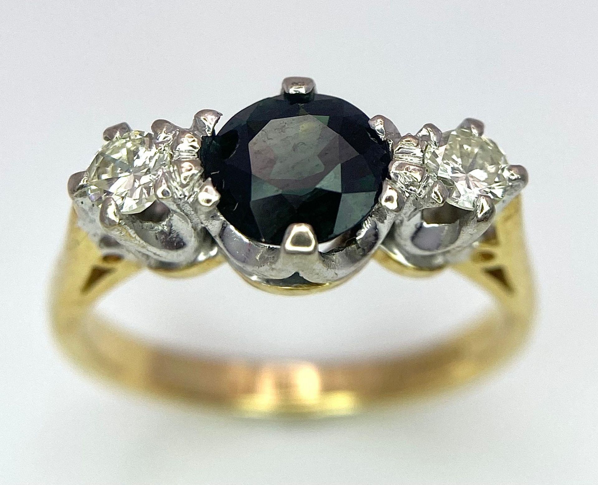 An 18K White Gold, Diamond and Sapphire Ring. Central round cut sapphire with a diamond either side. - Image 2 of 6