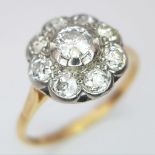 An 18 K yellow gold ring with a large diamond cluster, size: T, weight: 3.4 g.