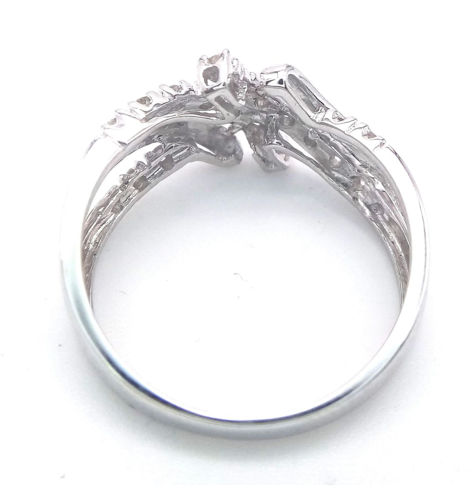 A FANCY 9K WHITE GOLD DIAMOND CROSSOVER RING, APPROX 0.15CT DIAMONDS, WEIGHT 2.6G SIZE Q - Image 9 of 12