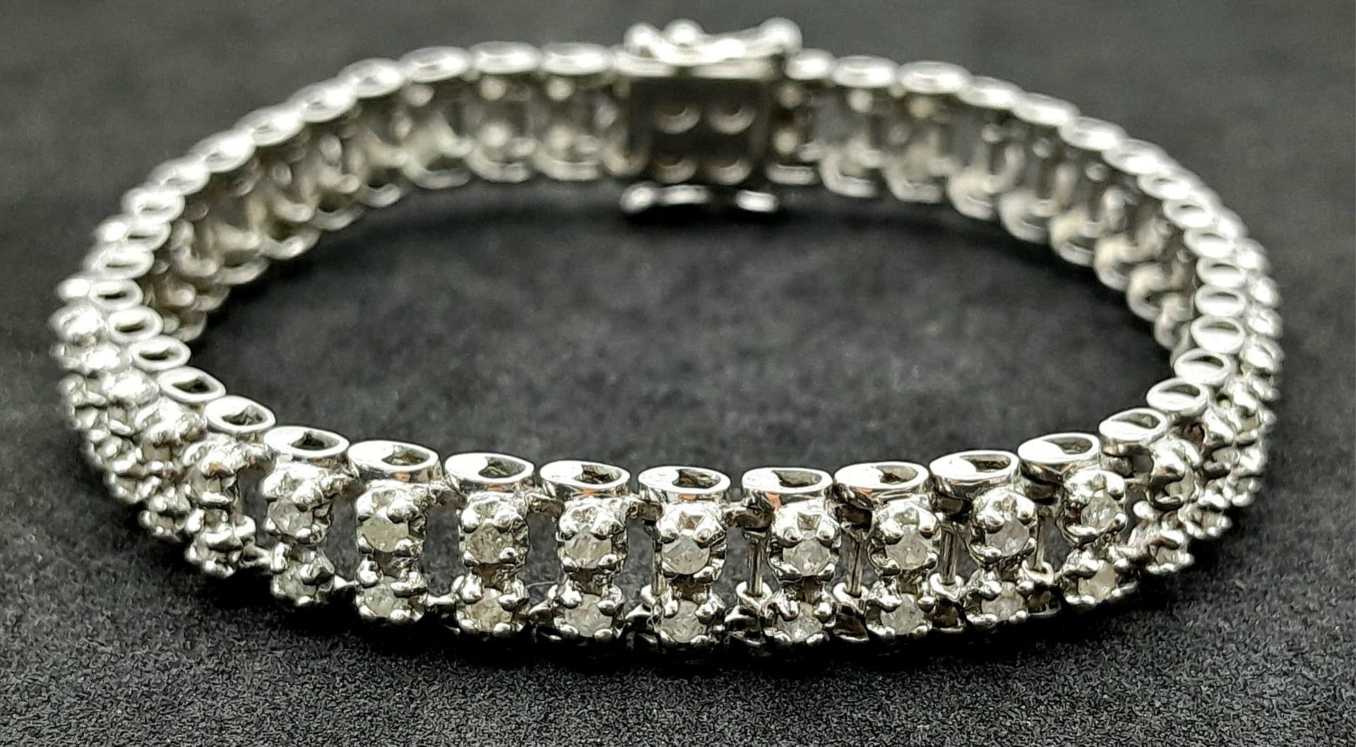 A 9K White Gold Diamond Tennis Bracelet. Two rows of 88 (total) diamonds! 18cm length. 15.3g total - Image 2 of 5