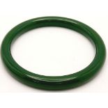 A Dark Green Thin Jade Bangle. 58mm inner diameter. 9mm width.