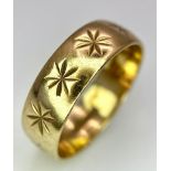 A Vintage 9K Yellow Gold Band Ring with Star Decoration. 5mm width. Size M. 2.8g weight.