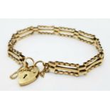 A 9K Yellow Gold Gate Bracelet with Heart Clasp. 17cm. 5.65g weight.