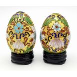 Two vintage and very ornamental Chinese cloisonne eggs standing on custom-made wooden bases. Height: