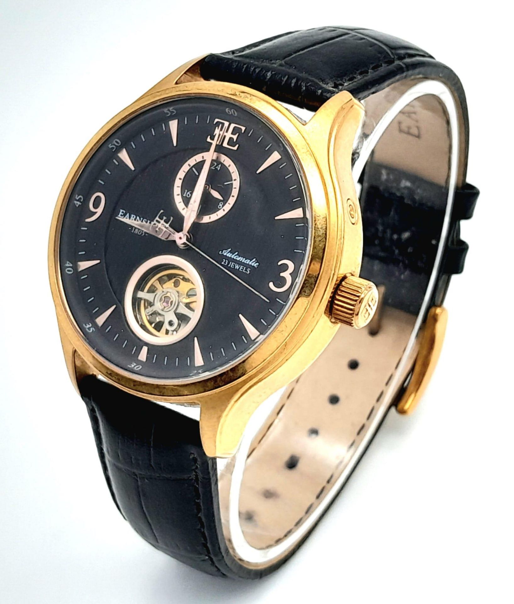 An Earnshaw 23 Jewels Automatic Watch. Black leather strap. Gilded case - 43mm. Black dial with