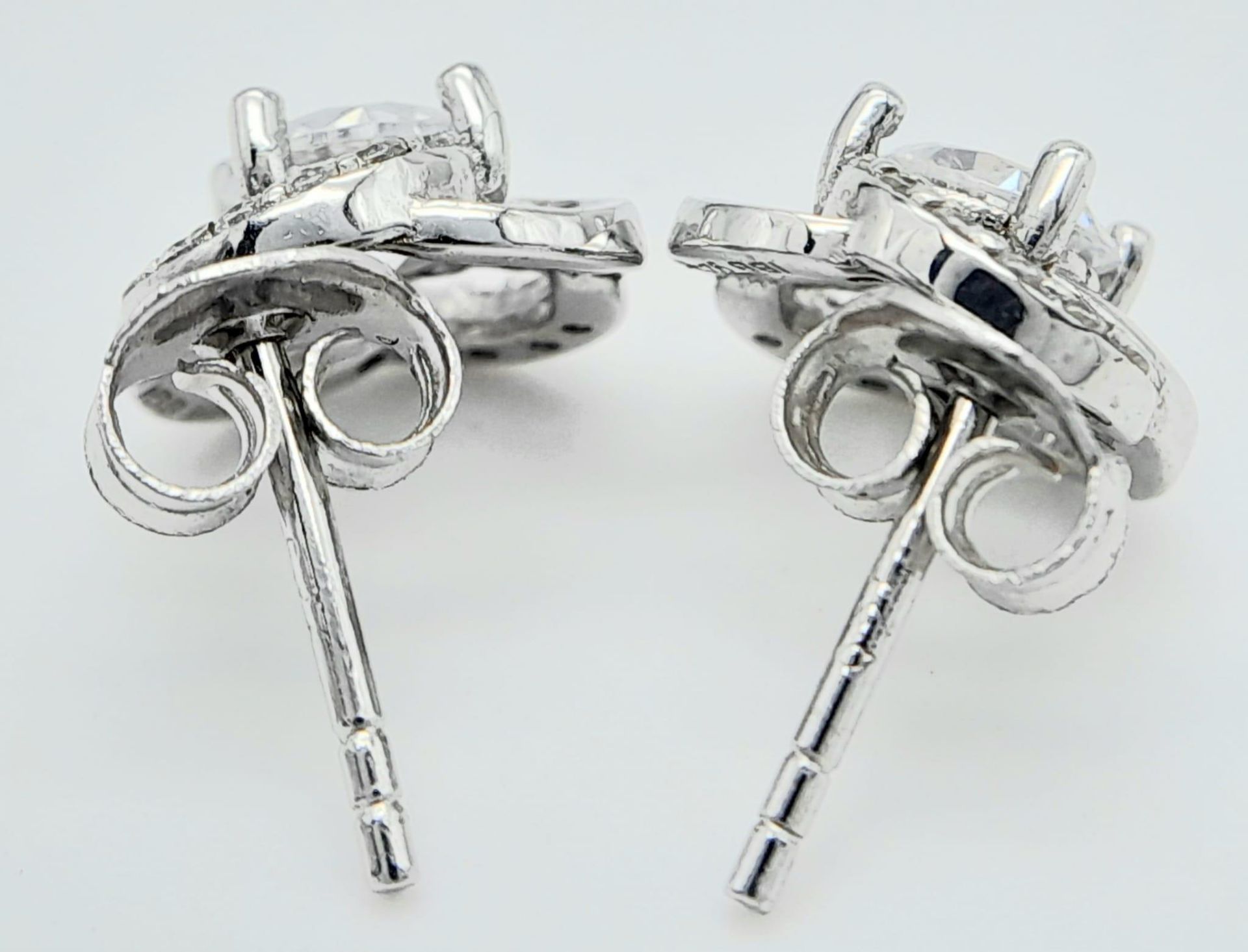 A fancy pair of 925 silver CZ earrings. Total weight 2.25G. - Image 3 of 9