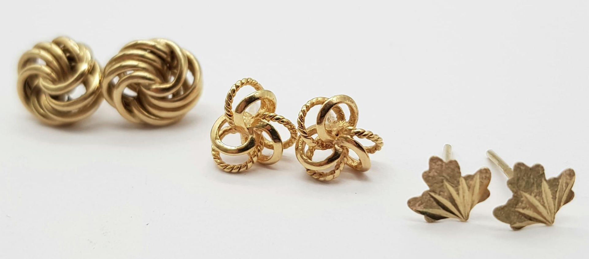 Three Pairs of 9K Yellow Gold Different Style Earrings - Knot, leaf and entwined. No backs. 1.9g - Image 4 of 5