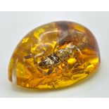 A Scorpion that is Not Concerned with WW3. Amber resin - pendant or paperweight. 6cm.