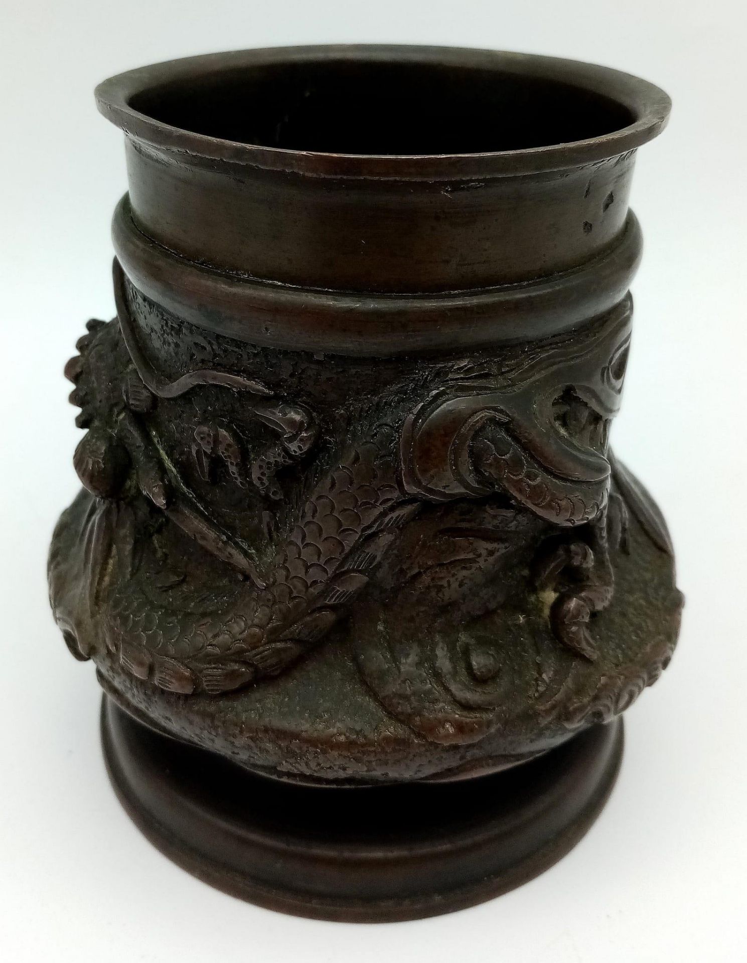 A Visually Stunning Antique Chinese Bronze Brush Pot - With wonderful flowing dragon decoration.