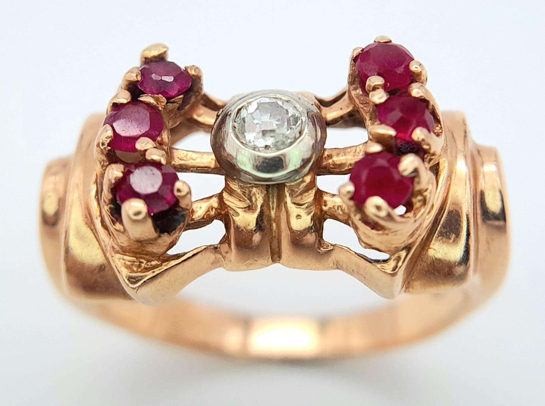 A 14K ROSE GOLD DESIGNER RING WITH CENTRAL DIAMOND FLANKED BY RUBIES . 8.1gms size L - Image 2 of 7