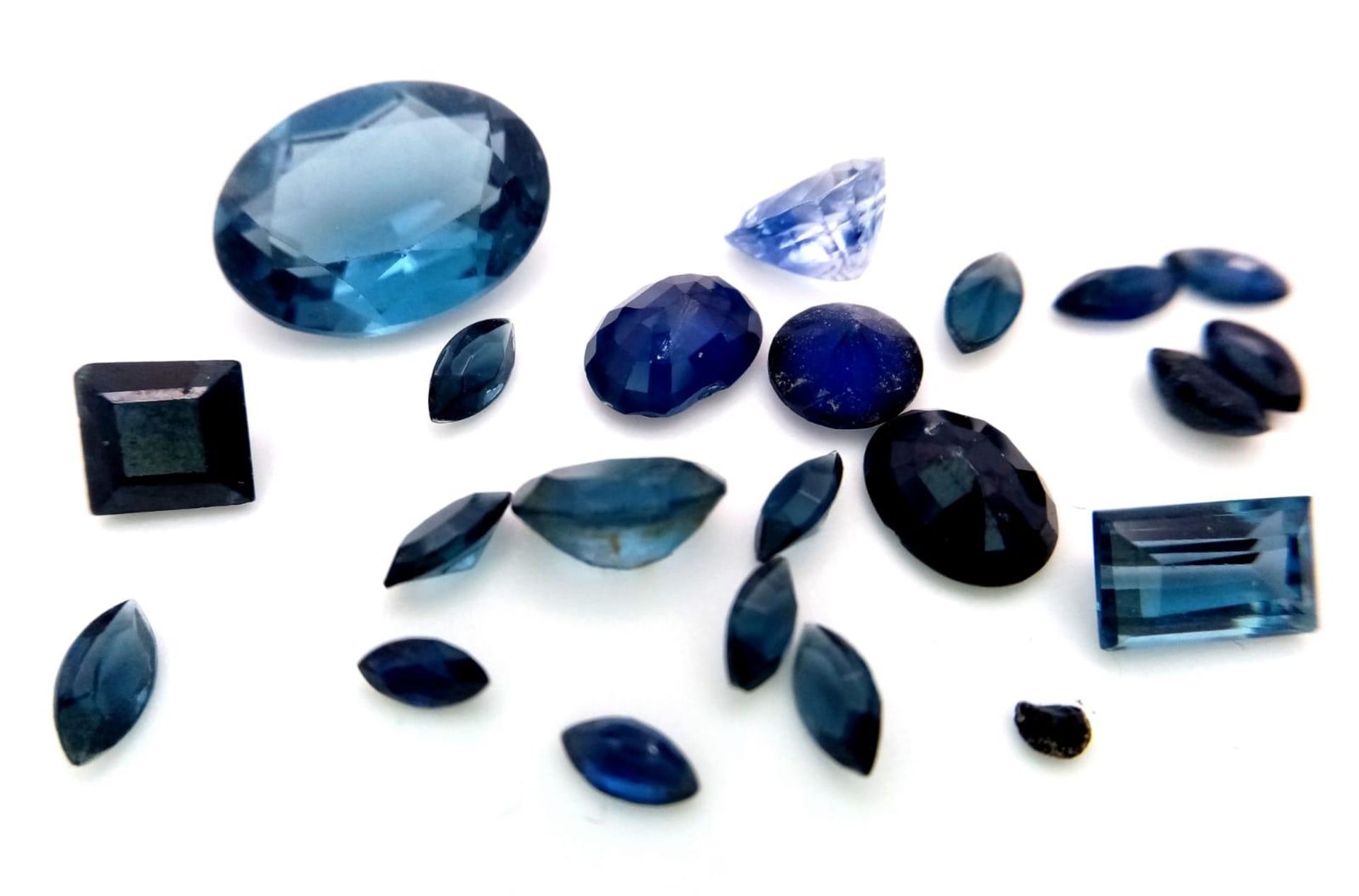 A Parcel of 21 Sapphires. Assorted Sizes and Cuts. 18.28 Carats Total.