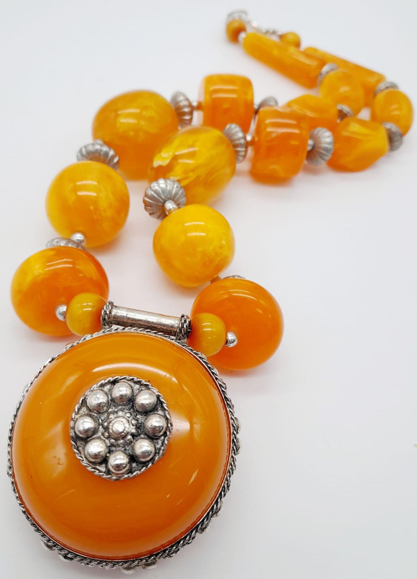 A Berber Amber Resin Statement Necklace and Pendant. 56cm length.