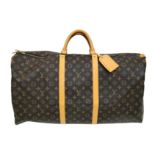 A Louis Vuitton Monogram Keepall 60 Travel Bag. Leather exterior with gold-toned hardware, two