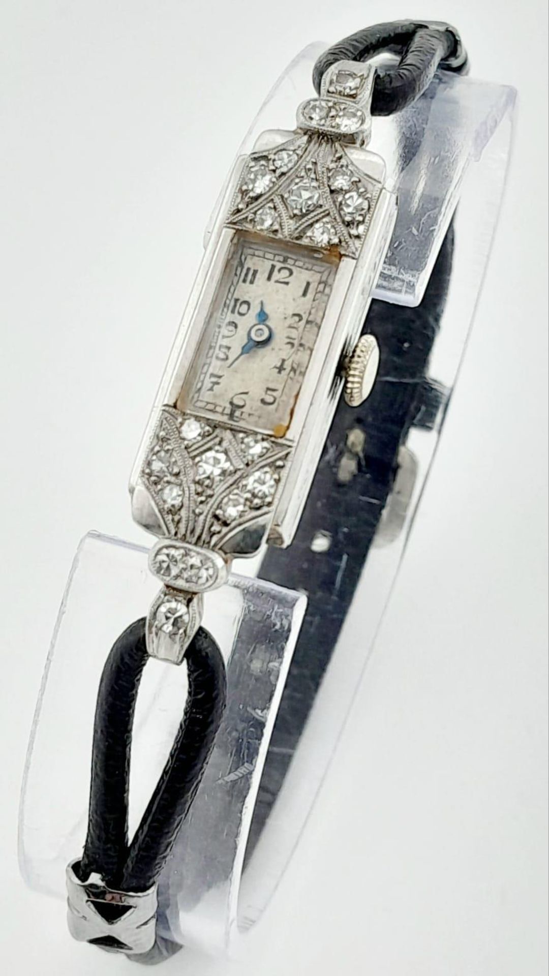 An Art Deco Platinum and Diamond Ladies Mechanical Watch. Rectangular case - 14mm. In working