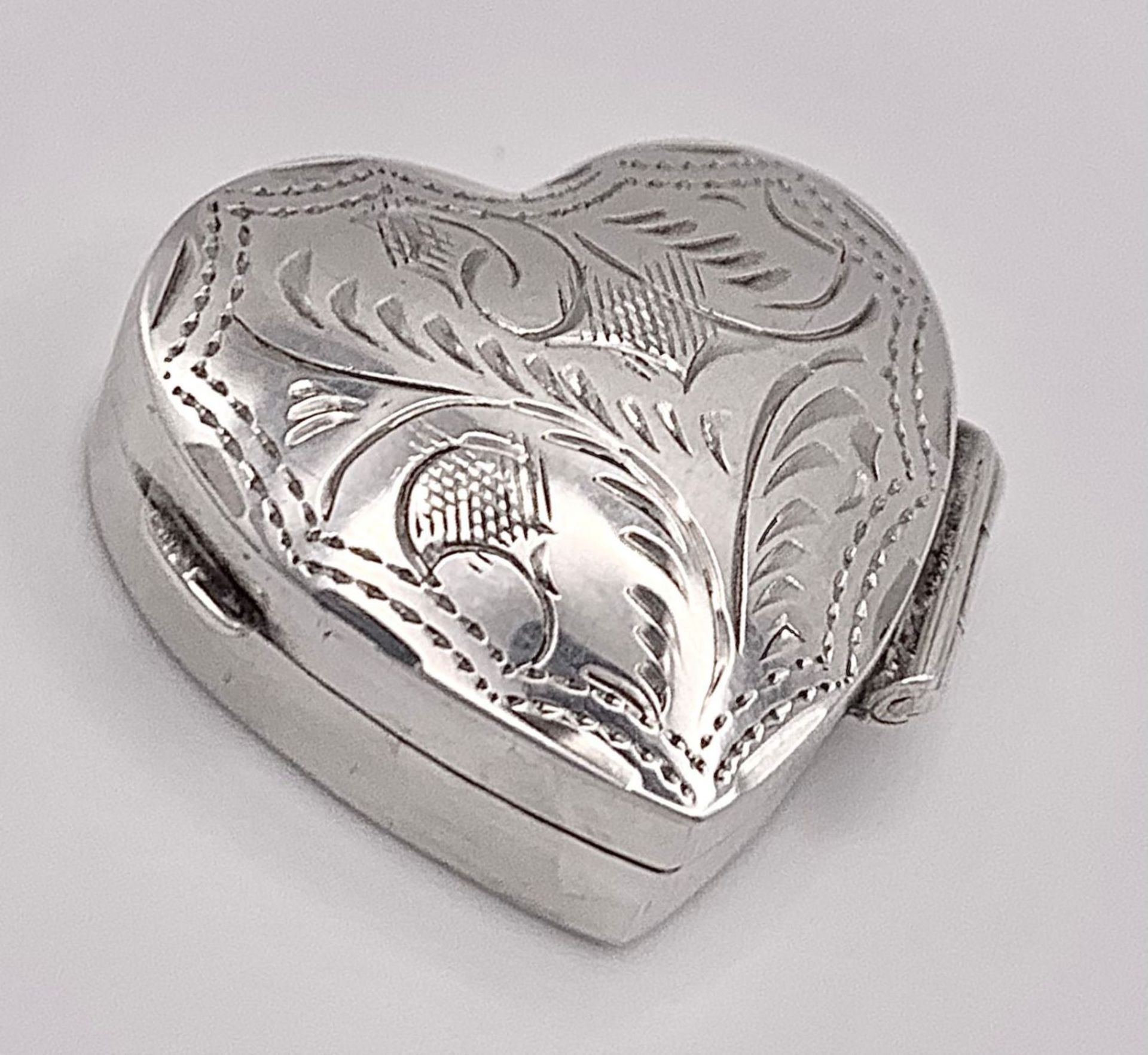 A Small Sterling Silver Heart Shaped Pill Box. Hallmarked. 2.5cm