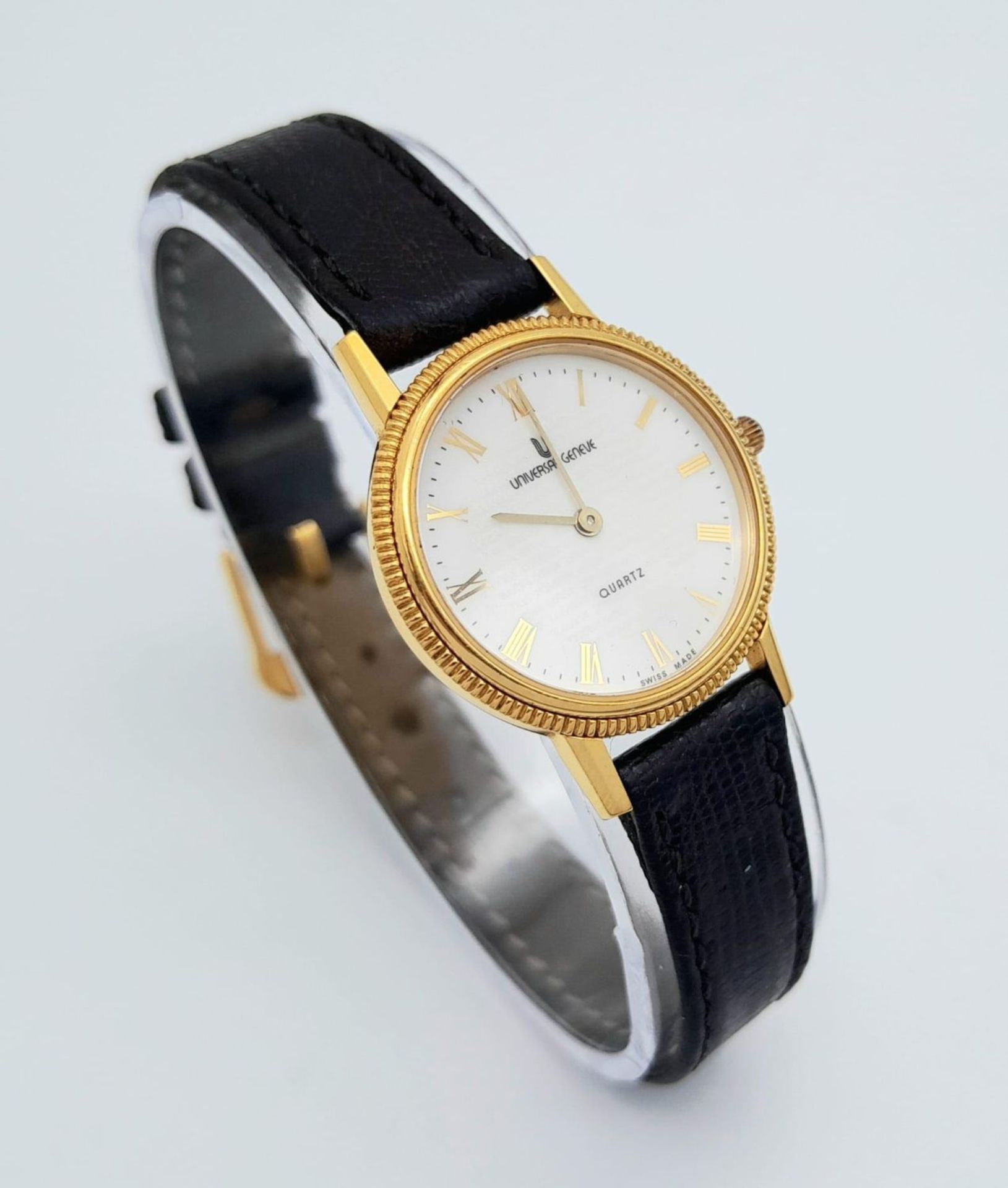 A Gold Plated Universal Quartz Ladies Watch. Black leather strap. Gold plated case - 23mm. White - Image 7 of 12