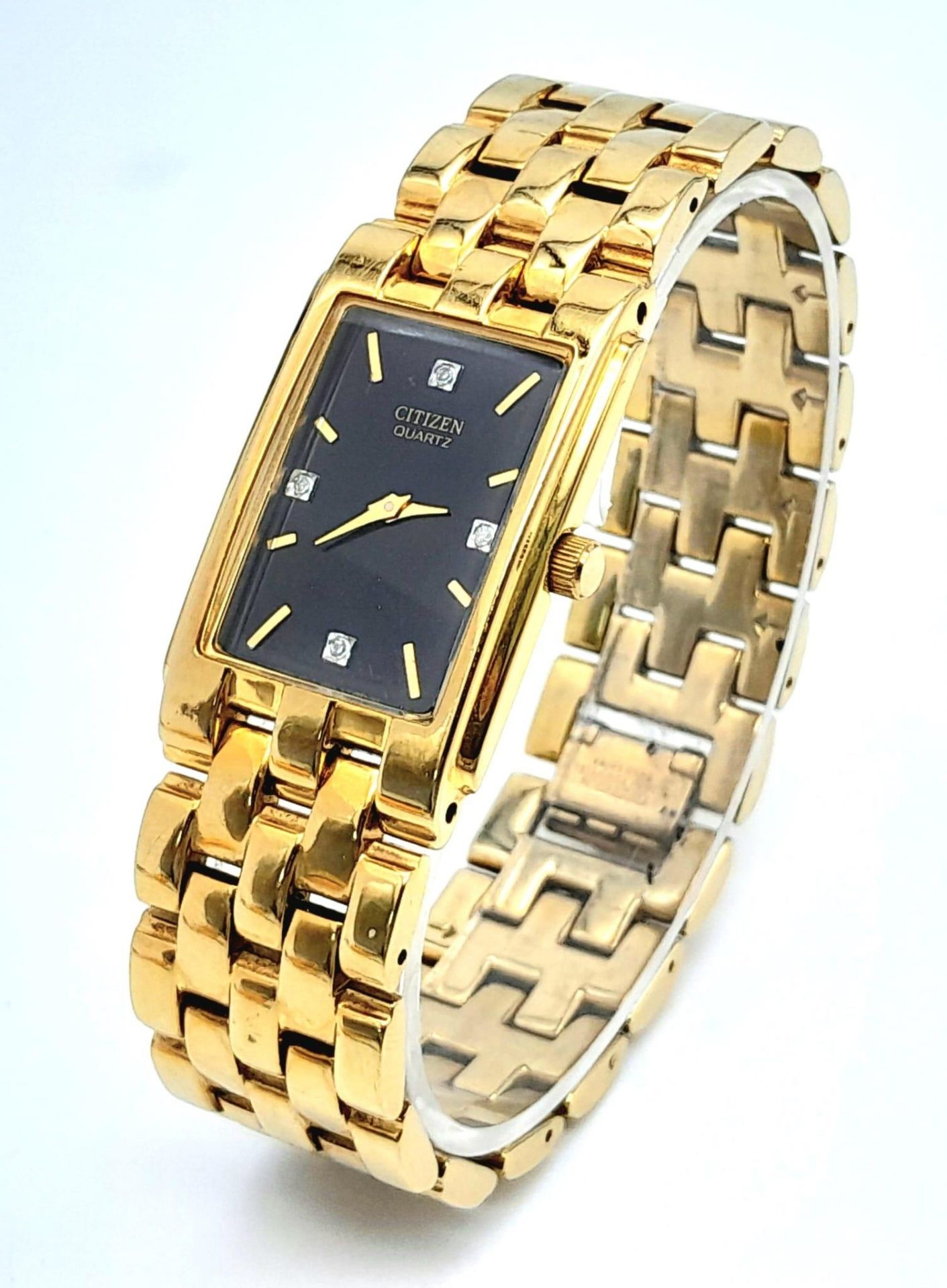 A Gold Plated Citizen Quartz Gents Dress Watch. Gold plated bracelet and rectangular case - 25mm.