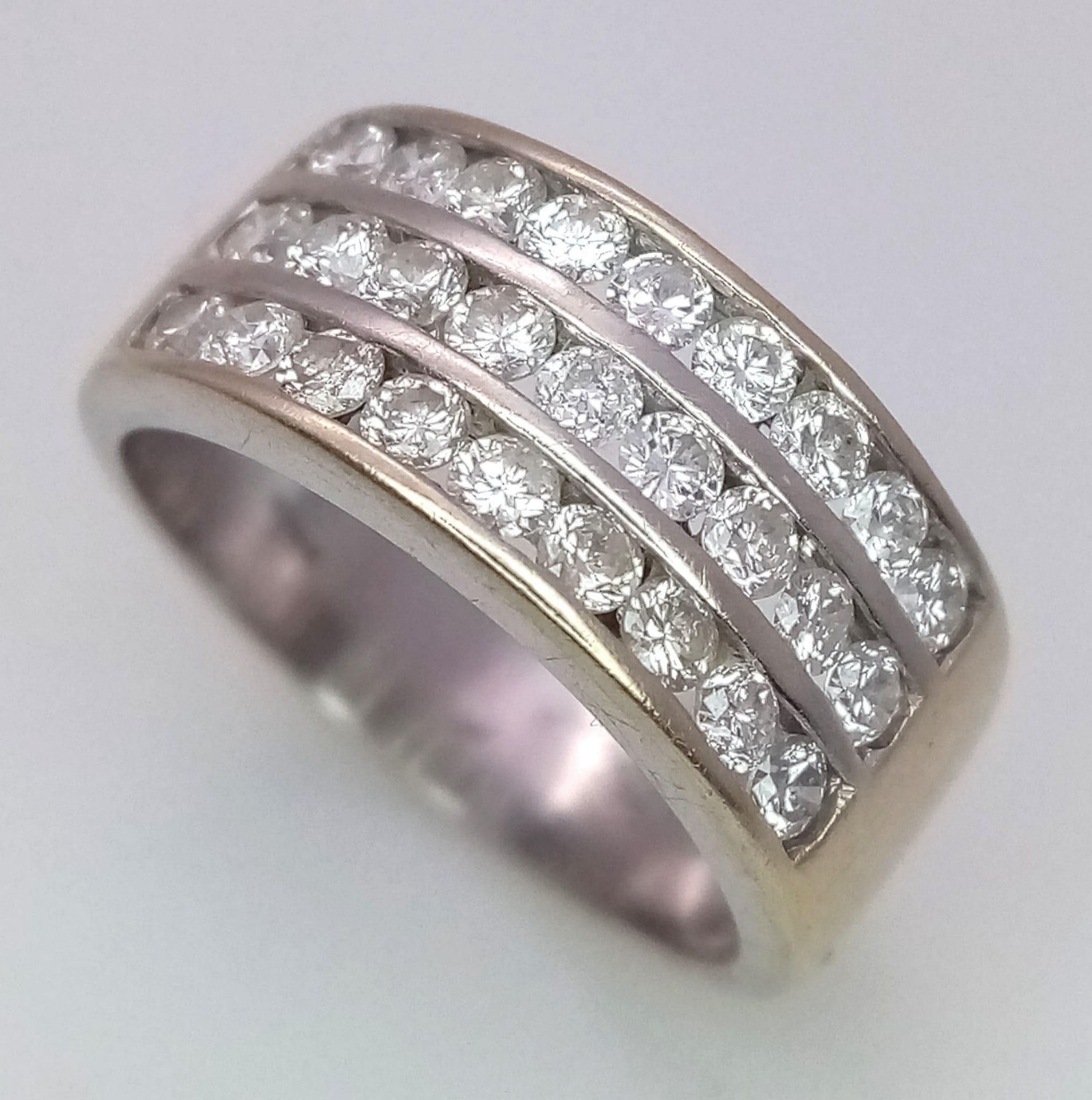 A well made 18 K yellow gold ring with three channels filled with round cut diamonds. Size: H, - Image 4 of 18