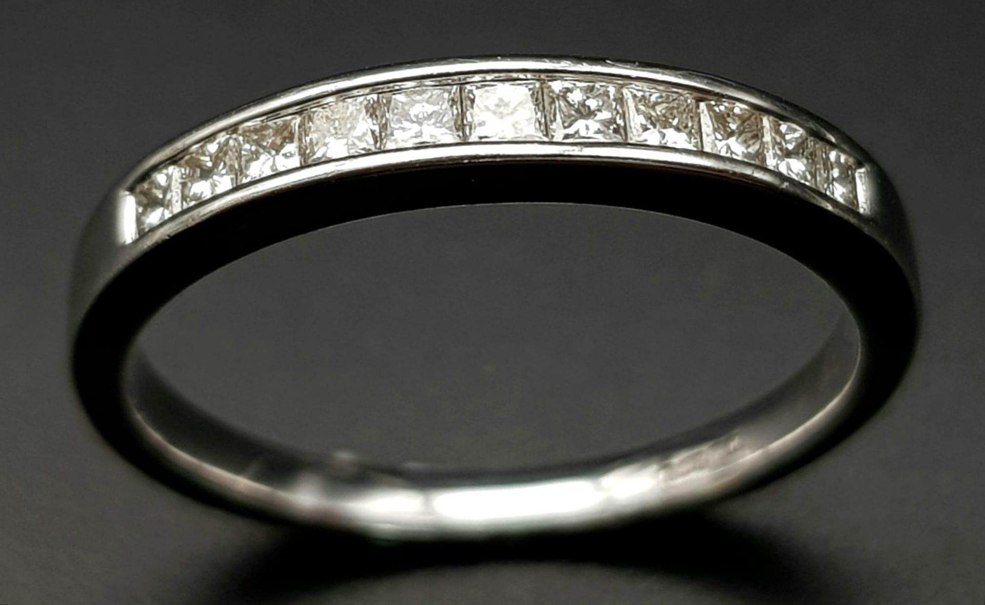 AN 18K WHITE GOLD DIAMOND 1/2 ETERNITY RING. CHANNEL SET PRINCESS CUTS. 0.35CTW. 2.5G. SIZE M - Image 2 of 5
