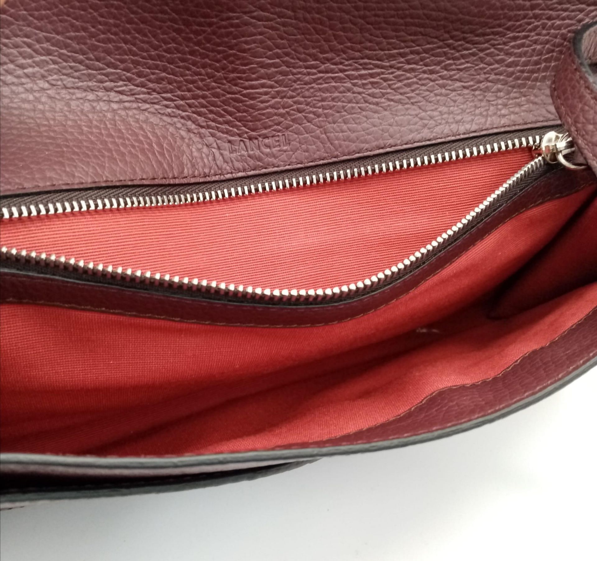 A Lance Burgundy Leather Hand/Shoulder Flap Bag. Textured leather exterior. Soft red textile - Image 10 of 16