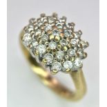 A 9K YELLOW GOLD DIAMOND CLUSTER RING. 0.50CT. 3.8G. SIZE K.