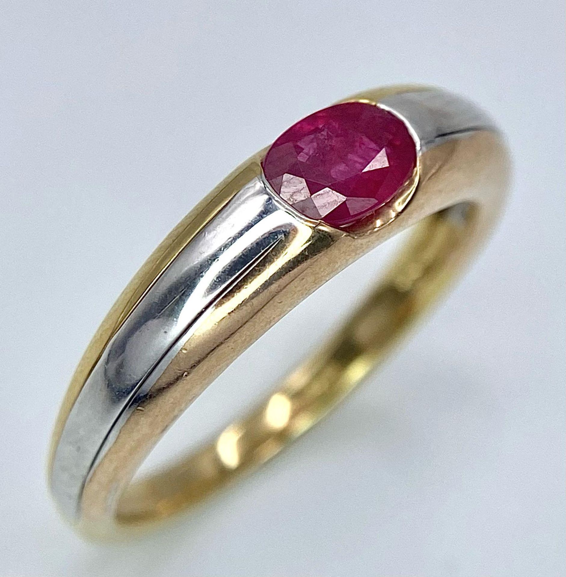 A 9K Yellow Gold Ruby Ring. Oval central ruby. Size N. 2.85g total weight. - Image 4 of 8