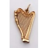 A 9K Yellow Gold Harp Pendant/Charm. 3cm. 1.9g weight.