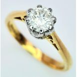 AN 18K YELLOW GOLD DIAMOND SOLITAIRE RING - 0.65CT. 8 CLAW SETTING. 3.4G. SIZE L.