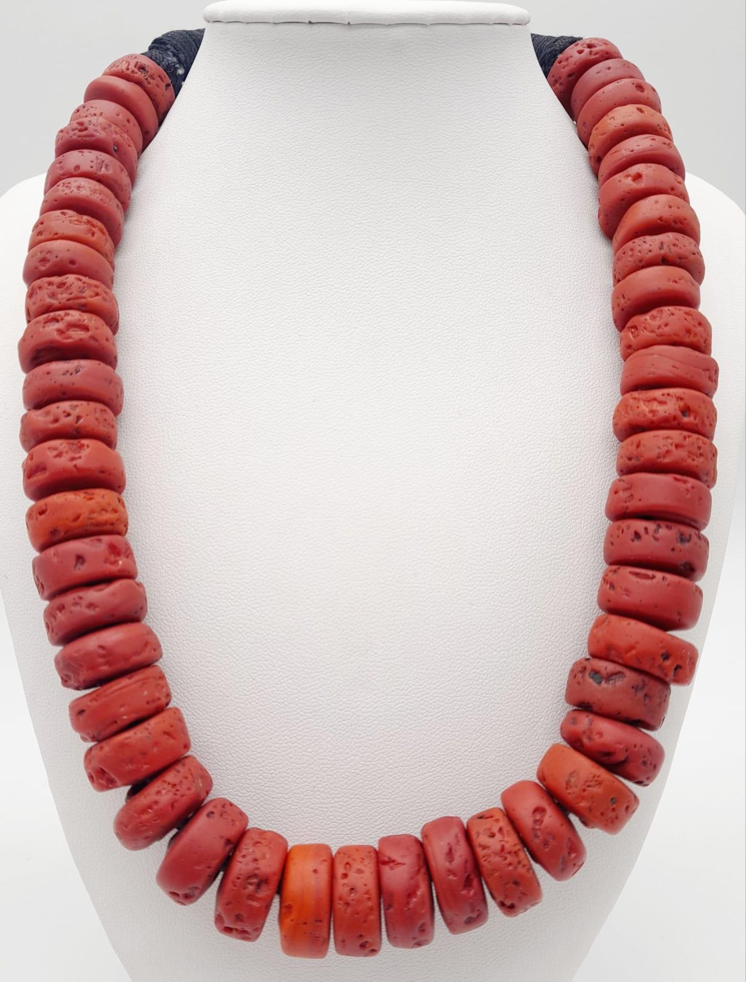 A Red Coral Rondelle Necklace. 44cm.