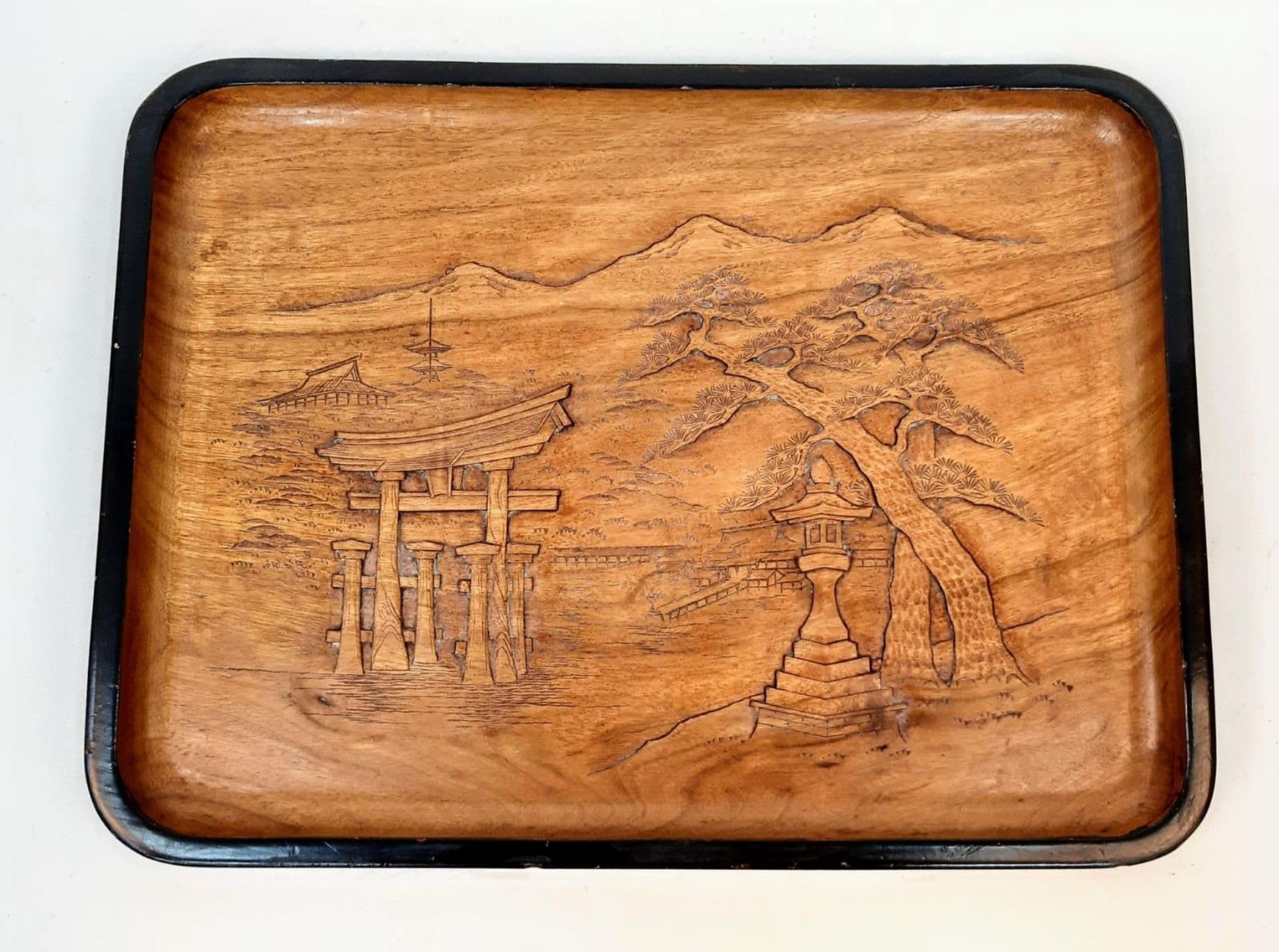 A vintage, Japanese, hand carved tray with the Itsukushima shrine, a UNESCO World Heritage Site.