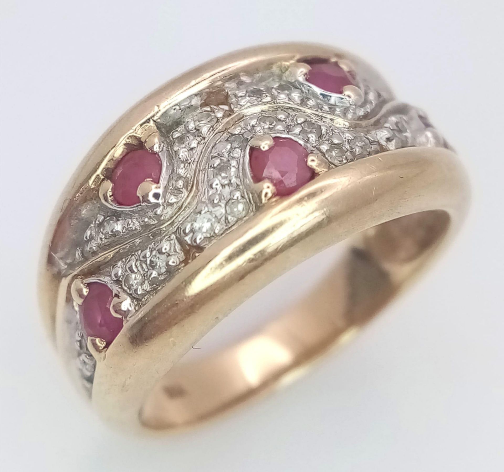 A 9K Yellow Gold Diamond and Ruby Ring. Size N, 4.8g total weight. Ref: SC 7064 - Image 2 of 4