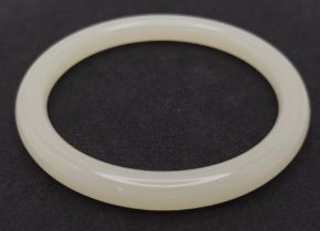 A Chinese Thin Jade Bangle. 10mm width. 6cm inner diameter.