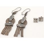 2X very stylish pairs of silver earrings. Total weight 12.6G. Please see photos for details.
